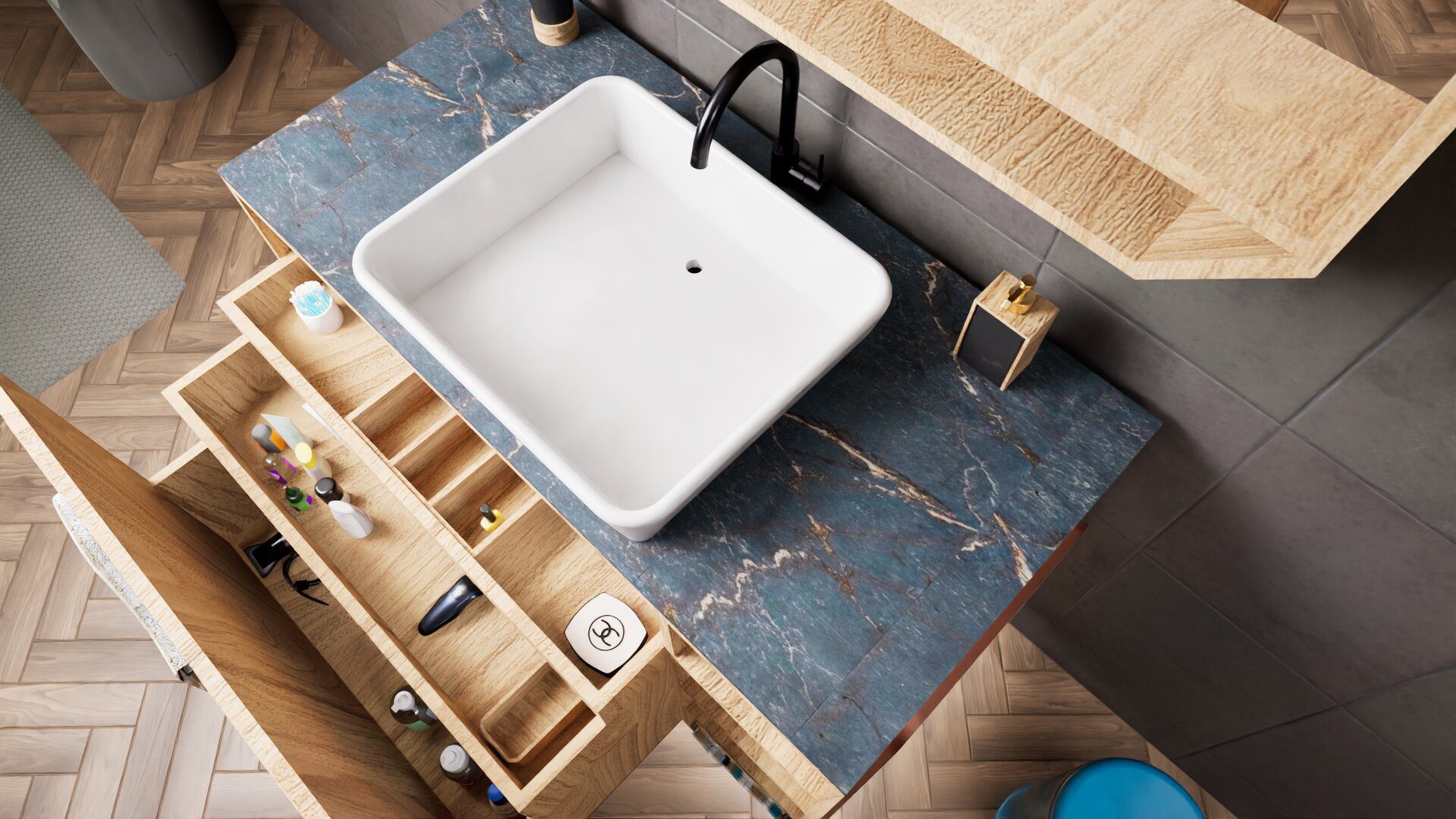 A modern bathroom sink with a square white basin, black faucet, blue marble countertop, and open wooden drawers containing toiletries.