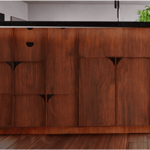 A close-up of a wooden cabinet with distinct geometric cutout handles and a black countertop above.