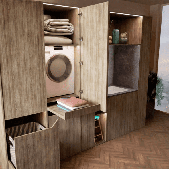 A modern laundry area with a washer, folded towels, storage shelves, decor items, and a basket, built into wood cabinetry beside a large window overlooking a cityscape.